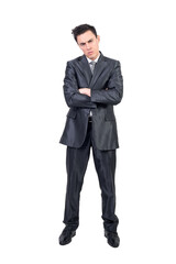 Bored elegant businessman with folded arms looking at camera