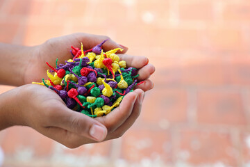 Boy holding Bang snaps or pop pops magical tricks crackers	
