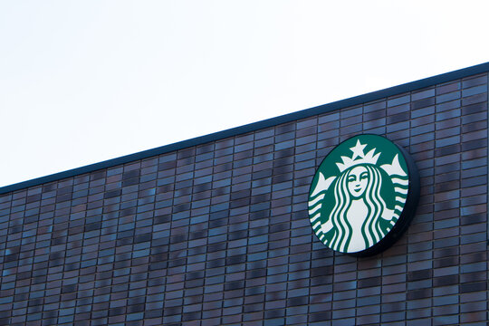 Kumamoto, Japan - Aug. 2, 2019 :
Starbucks Coffee logo on the store wall. Starbucks Co. is an USA coffee company. The first Starbucks location outside North America opened in Tokyo, Japan, in 1996.