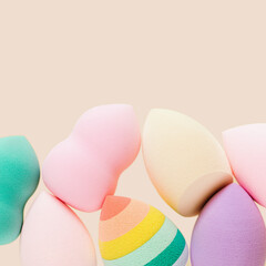 Colorful cosmetic beauty sponges different form Green, violet, rainbow colored makeup tools for tone cream