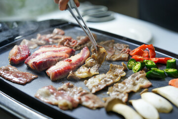 Korean beef barbecue a popular Korean dish with vegetables, green pepper, red pepper, carrot and masroon barbecue. 