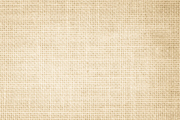 Jute hessian sackcloth burlap canvas woven texture background pattern in light beige cream brown color blank, linen and cotton cloth.