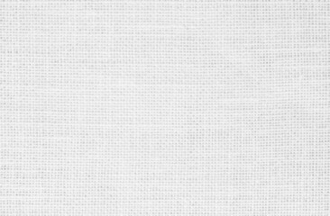 White fabric jute hessian sackcloth canvas woven gauze texture pattern in light white color blank. Natural linen and cotton cloth.