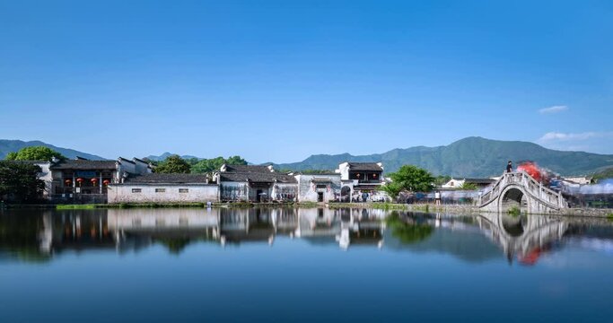 Chinese ancient village in afternoon, beautiful Hongcun was packed with visitors, time lapse