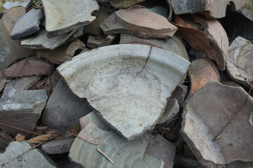 Ancient sample of bowl-pieces, coarse stoneware body with light green glazed on interior....
