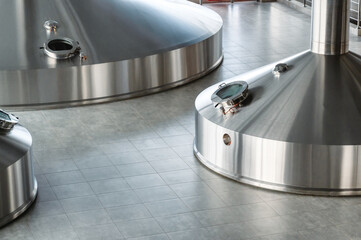 Mash vats of a brewery. Large metal fermentation tanks