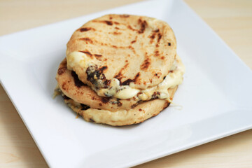 Pupusas from El Salvador dish isolated on a stylish white plate