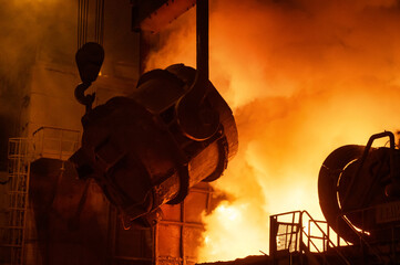 The metallurgical bucket hangs on a special crane beam