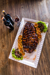 luxury grilled barbeque pork ribs spare with dark sweet honey sauce with corn, tea leaves and red...