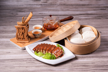 chinese traditional kong bak bao mantou sliced braised pork belly with dark soy sauce with steamed...