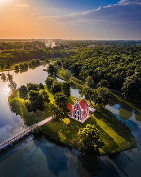 Deg, Hungary - Aerial panoramic view about the beautiful Holland house (Hollandi haz) on a small island at the village of Deg on a summer sunrise with blue and orange sky