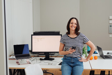 Confident businesswoman with a beaming friendly smile