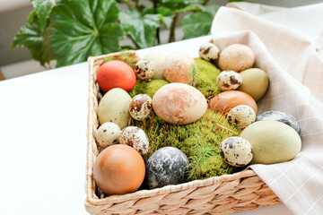 Preparing for Easter, coloring pages with natural dyes with turmeric, hibiscus, onions. Painted Easter eggs on the table