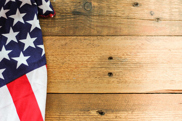 Fototapeta na wymiar American flag Placed on a wooden background.