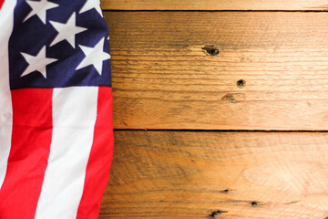 Fototapeta na wymiar American flag Placed on a wooden background.