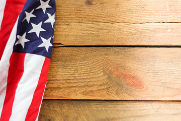 American flag Placed on a wooden background.