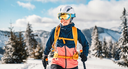 Mountaineer backcountry ski walking ski woman alpinist in the mountains. Ski touring in alpine...