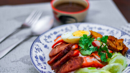 Rice with Red Roast Pork Served Boiled Egg and topped with Sweet Sauce.