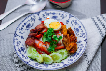 Rice with Red Roast Pork Served Boiled Egg and topped with Sweet Sauce.