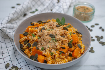 pasta alla zucca, healthy home made pumpkin pasta on a table