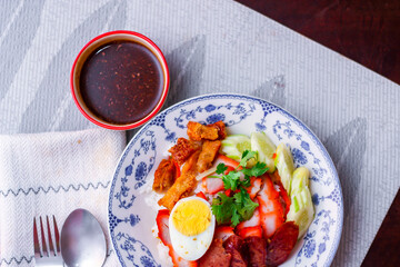 Rice with Red Roast Pork Served Boiled Egg and topped with Sweet Sauce.