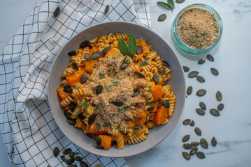 pasta alla zucca, healthy home made pumpkin pasta on a table