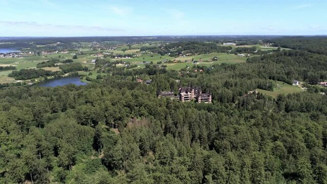 Tower tops of unfinished Lapalice castle in Poland, aerial fly backward shot