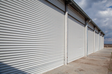 Storage units with roller shutter doors in industrial area