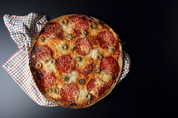 Lazy lavash-based pizza with salami and olives