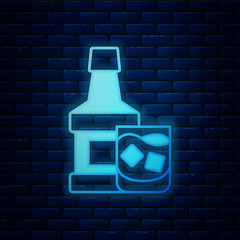 Glowing neon Whiskey bottle and glass icon isolated on brick wall background. Vector