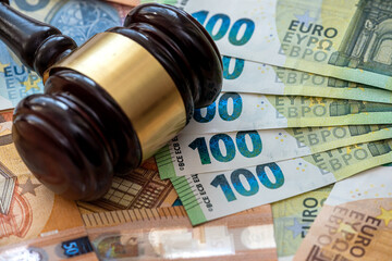 Judge's gavel on  euro bills background. - obrazy, fototapety, plakaty