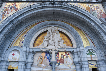details of the main entrance to the Basilica of Our Lady of the Rosary, in the Sanctuary of Lourdes. Place of worship and pilgrimage - obrazy, fototapety, plakaty
