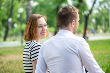 Fototapeta premium Young couple on a date in the park