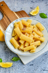  Italian home made  rigatoni   pasta  with  tuna  fish, parmesan cheese and black pepper .