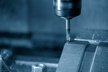 Closeup scene the press die manufacturing process by CNC milling machine with ball end mill tool.