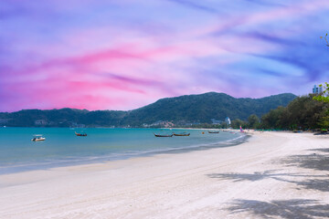 Obraz premium Long tail Boat on colourful sunset over a Beach in Phuket Thailand