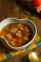 a bowl of beef cooked in spicy soup named asem asem in Bahasa 