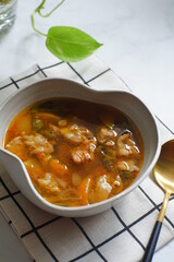 a bowl of beef cooked in spicy soup named asem asem in Bahasa 