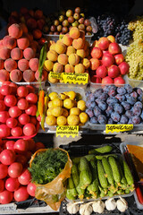 Fruit market with various colorful fresh fruits and vegetables. Price tags in russian