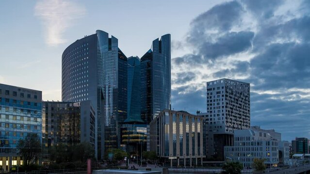 Some of the Towers and Hotel at La Defense Business District Paris at Day With Clouds Pedestrians