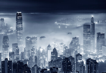 Fototapeta na wymiar foggy night view of Victoria harbor in Hong Kong city