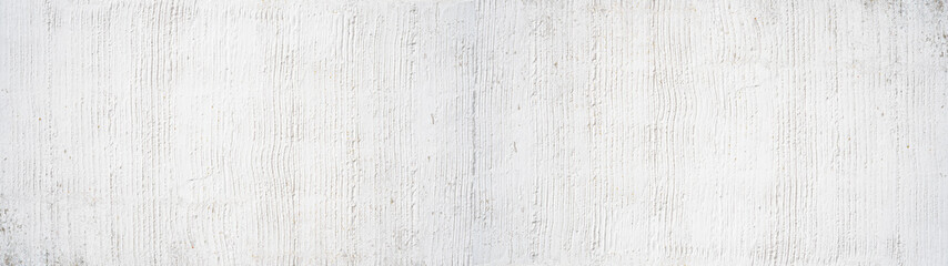 White rough filler plaster facade wall texture background.banner panorama, with vertical line corrugation