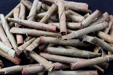 bidi, you can say it as desi or Indian cigarette, made of dry leaves 