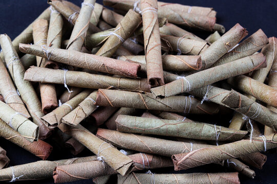 bidi, you can say it as desi or Indian cigarette, made of dry leaves 