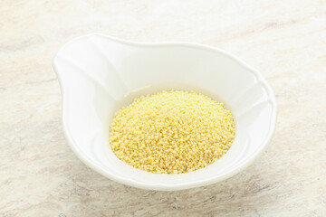 Raw couscous in the bowl