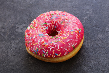 Sweet glazed struwberry donut with icing