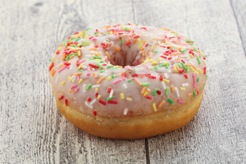 Sweet glazed vanilla donut with icing