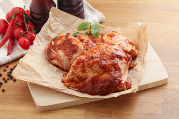 Marinated chicken leg in tomato sauce