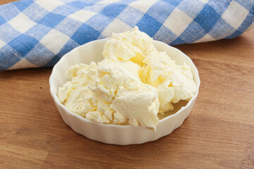 Italian soft mascarpone cheese in the bowl