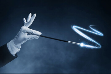 Magician hand holding magic wand on dark background